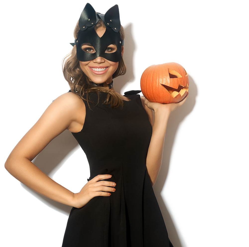 Youg woman dressed as a cute black cat 