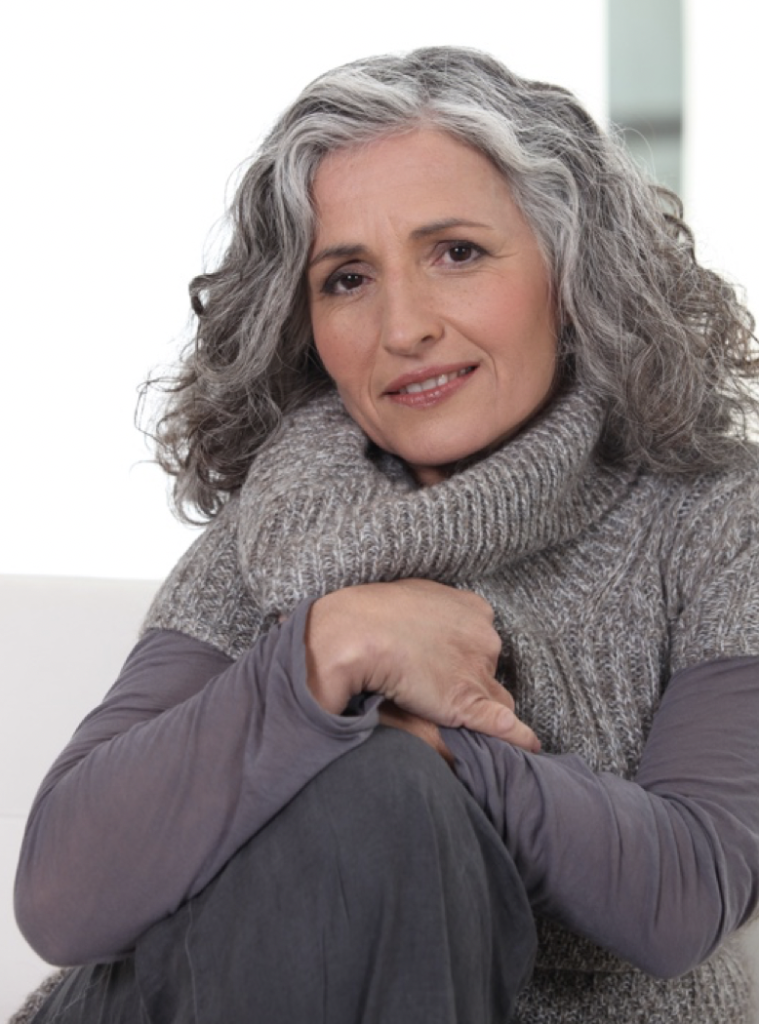 Grey haired woman in sweater