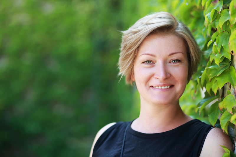 Blonde woman posing for headshot