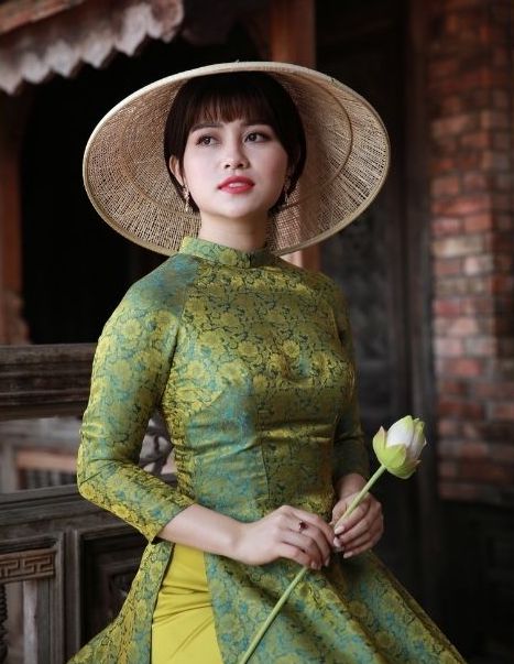 Beautiful Asian woman in a yellow green dress.