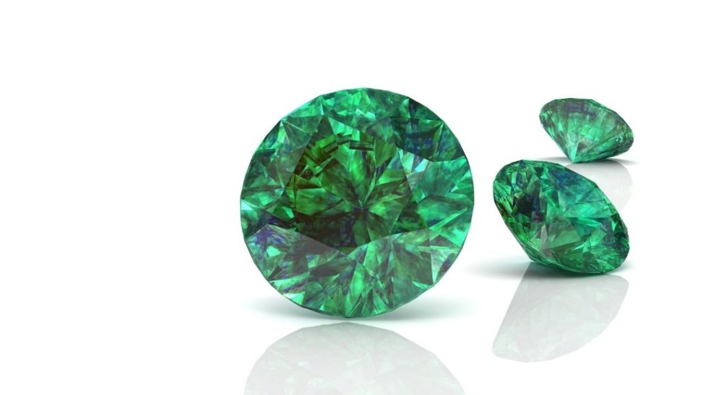 Three green round emerald jewels.
