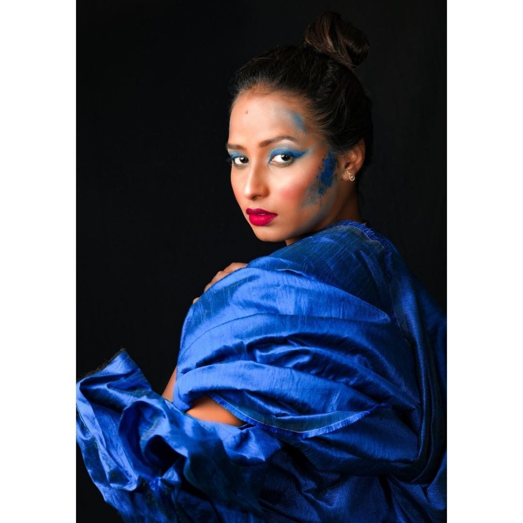 Woman in royal blue scarf