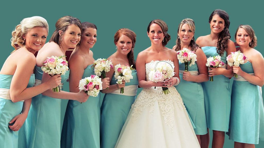 Bridesmaids wearing teal dresses