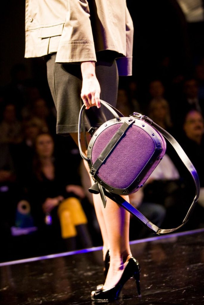 Woman carrying a purple purse