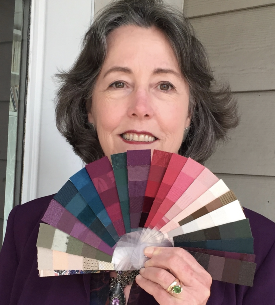 Mary Lou Manlove holding her personal color swatches.